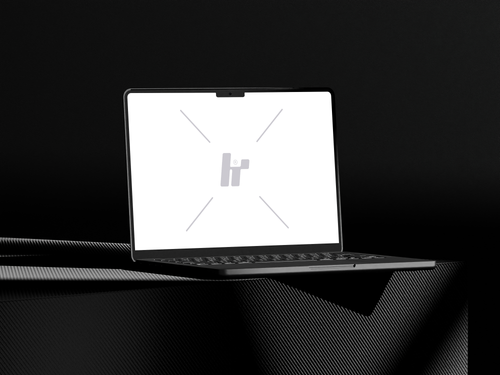 Free download a MacBook Mockup on a Carbon Table